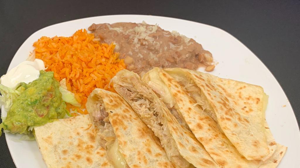 Quesadillas · Cheese quesadilla with meat of your choice, rice, beans and salad and sour cream on the side.