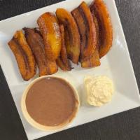 Platanos Frito · Fried Plantain served with side of beans and sour cream.