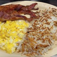 Bacon And Eggs · 2 Eggs over medium, shredded hash brown,  bacon and white toast.