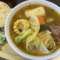 Caldo De Res · Beef stew served with a small side of rice and two handmade tortillas.