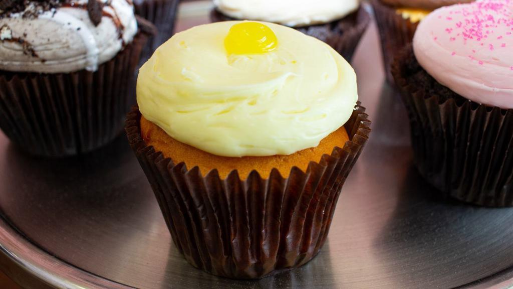 Lemon Drop · Vanilla cake with lemon filling, topped with lemon buttercream and a dollop of lemon filling.