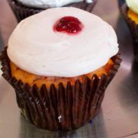 Strawberry · Strawberry cake with strawberry buttercream garnished with a slice of strawberry.