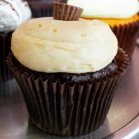 Peanut Butter Cup Cupcake · Chocolate cake with peanut butter cream cheese frosting topped with crumbled peanut butter c...