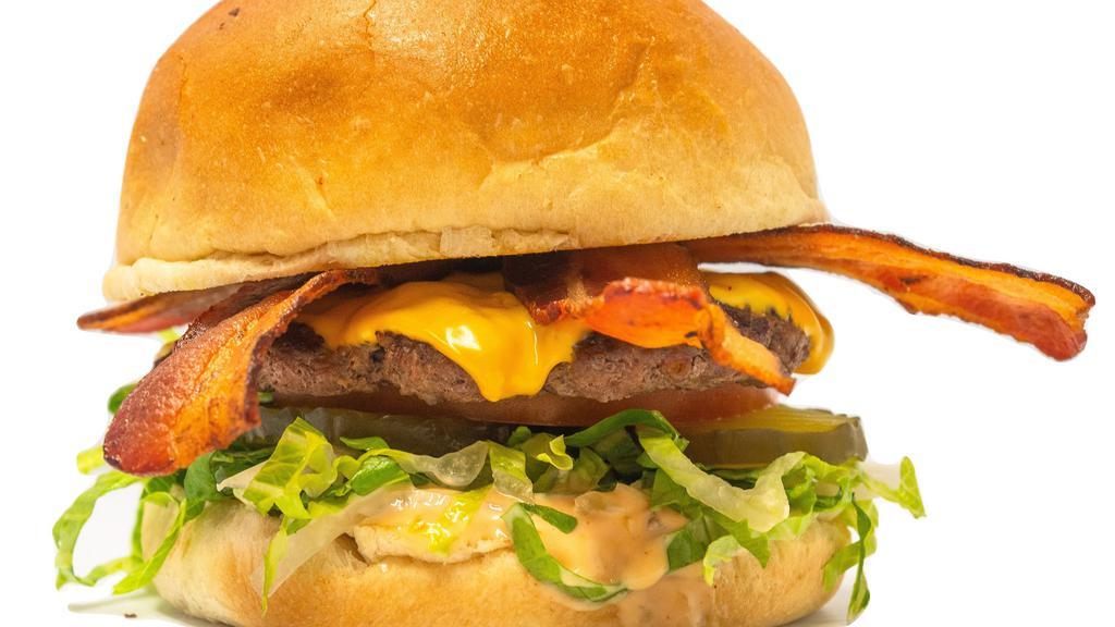 Bacon Cheeseburger · Most popular. 1/4 pound 100% fresh beef, American cheese, 3 slices double smoked bacon, shredded iceberg lettuce, tomato, pickle, onions and 1000 island dressing. Served on a fresh brioche bun.