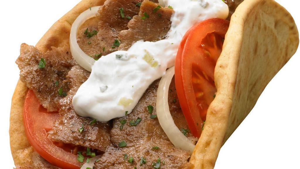 Gyro Sand. · Slices of gyro meat, tomato and red onion on pita bread. Gyro sauce on the side.