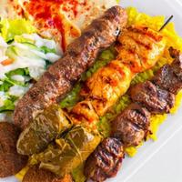 The Works · Beef kabob, kofta kabob, chicken kabob, two falafel patties and two hand rolled grape leaves.
