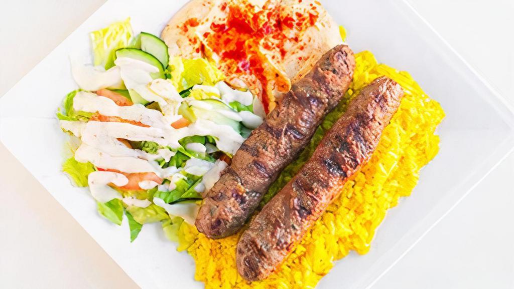Kofta Kabob Plate · Two kofta skewers, salad, hummus, rice, pita bread.