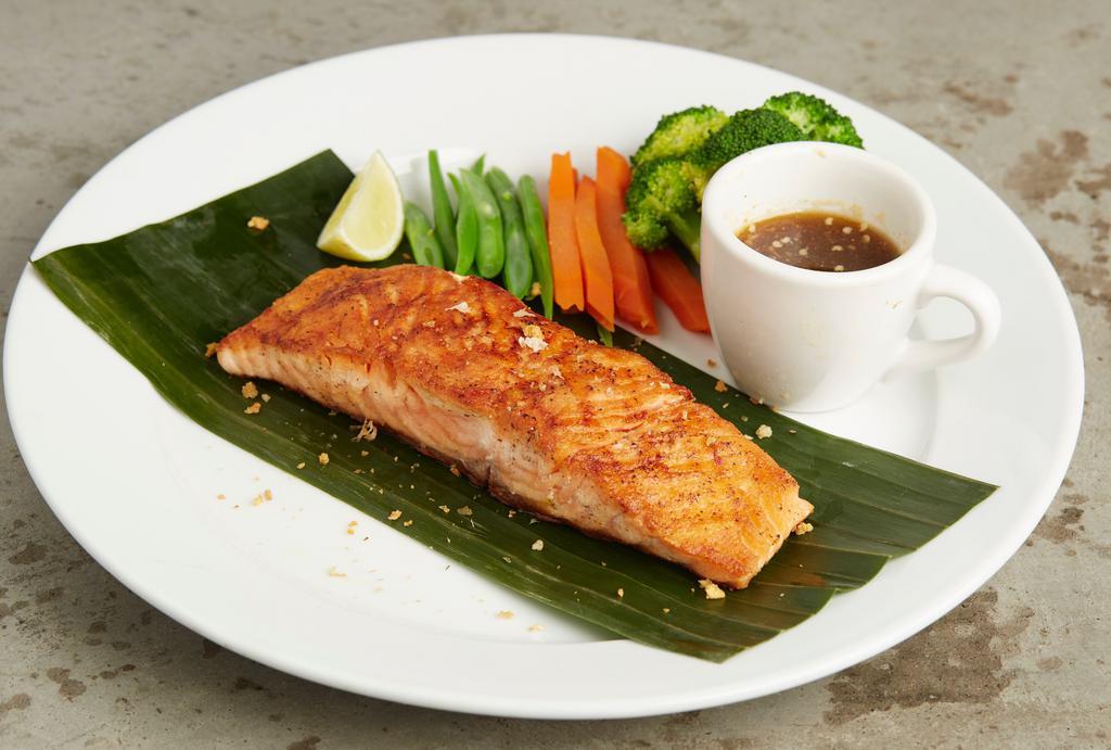 Thai Bbq Salmon · Spicy. Grilled marinated salmon served on a bed of assorted vegetables with spicy lime and teriyaki sauce.