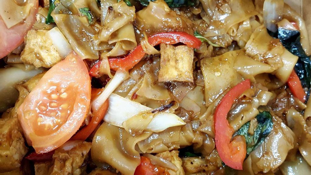 Drunken Noodles · Stir-fried nat rice noodles, tomato, bell pepper, onion, bean sprouts and basil leaves.