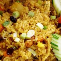 Basil Fried Rice · Pan-fried rice with thai chili. Garlic, bell peppers. Thai basil leaves, carrots and peas.
