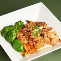 Pad Garlic · Sautéed with fresh garlic, black pepper, and green onions. Served on a bed of vegetables.