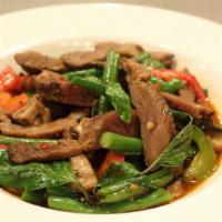 Kaprow Moo Yang · Medium spicy. Stir-fried grilled pork, bell pepper, chili, onion, mushroom, string beans, th...