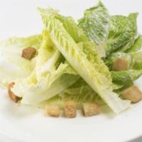 Caesar Salad · Brioche croutons, Parmesan cheese, creamy togarashi garlic dressing.