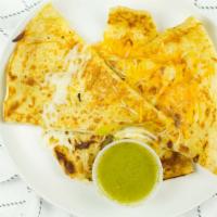 Cheese Quesadilla · Traditional cheese quesadilla served with green salsa on the side.