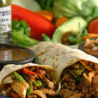Fajita Burrito · Grilled steak or chicken with onions, bell peppers, and tomatoes, grilled to perfection.