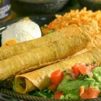 Five Taquitos · Crispy hand-rolled corn tortillas, filled with shredded beef or chicken and topped with guac...