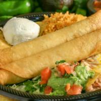 Two Flautas · Fried rolled flour tortillas stuffed with cheese and choice of shredded beef or chicken. Com...