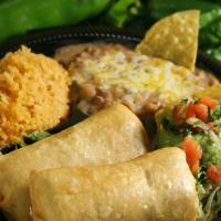 Two Chimichangas · Fried burritos stuffed with cheese and choice of shredded beef or chicken. Comes with sour c...