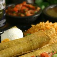 Two Taquitos · Crispy hand-rolled corn tortillas, filled with shredded beef or chicken and topped with guac...