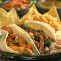Two Soft Tacos · Two grilled steaks, chicken or carnitas tacos served on two corn tortillas each with fresh g...