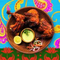 Tandoori Chicken · Chicken marinated in yogurt and grilled.