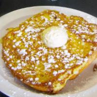 Thick Sliced French Toast · Butter and powdered sugar.