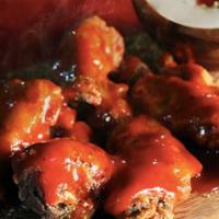 Gourmet Wings · 8 pieces of our Halal Hand Slaughtered home made Wings mixed with our in-house Gourmet Sauce