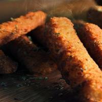 Fried Zucchini Sticks · 10 pcs of our in house coated and delicious deep fried zucchini