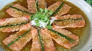 Sesame Seared King Salmon · Yuzu soy, hot sesame, olive oil, toasted sesame seeds, ginger, chives.
