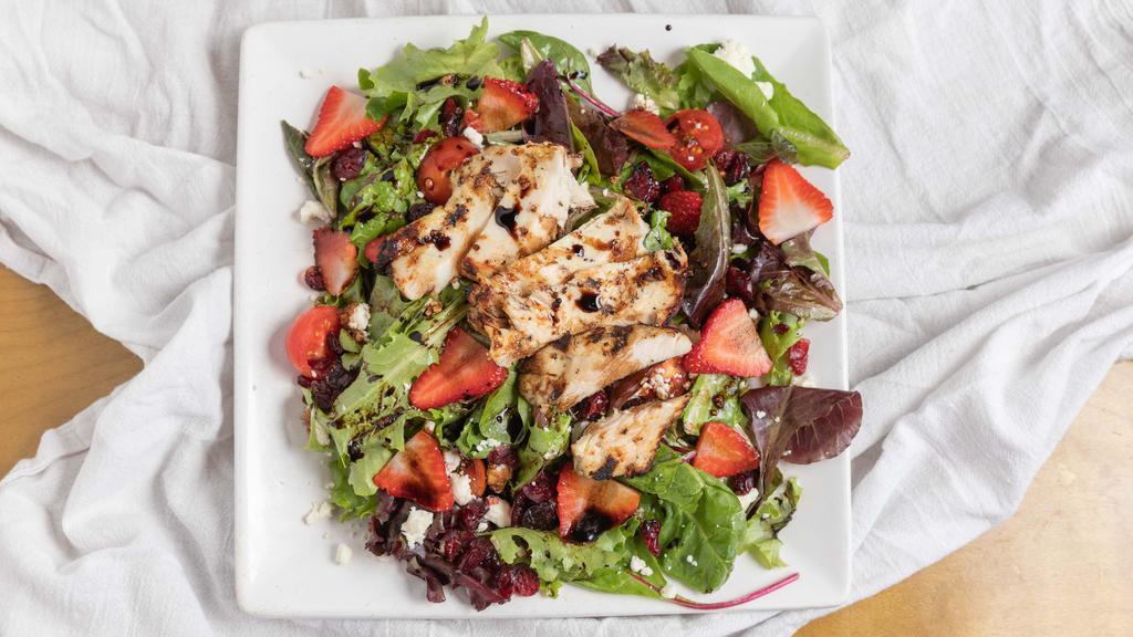 Strawberry Salad · Spring mix, dried cranberries, feta cheese, strawberries, balsamic reduction, champagne vinaigrette.