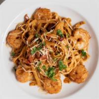 Cajun Shrimp Pasta · Cajun shrimp, garlic, fettuccine, cajun alfredo sauce.