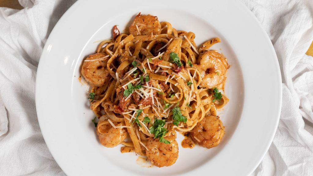 Cajun Shrimp Pasta · Cajun shrimp, garlic, fettuccine, cajun alfredo sauce.