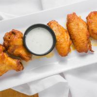 Buffalo Wings (6 Pcs.) · 6 pieces of our delicious buffalo wings served with either ranch or blue cheese sauces.