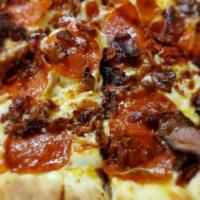 Meat Lover Pizza · Pepperoni, bacon, ham, sausage and mozzarella cheese.