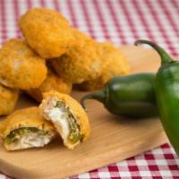 Jalapeño Poppers · Fresh battered jalapeños filled with cream cheese and deep fried.