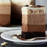 Chocolate Mousse Cake · Layered chocolate mousse and zabaione, topped with chocolate curls.