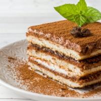 Tiramisu · Flavorful espresso drenched ladyfingers separated by mascarpone cream and dusted with cocoa ...