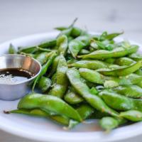Edamame · Bowl of steamed organic young soybeans in pods, lightly tossed in salt and garlic oil