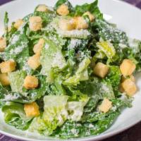 Caesar Salad · Organic lettuce, seasoned croutons, Parmesan cheese and caesar dressing.