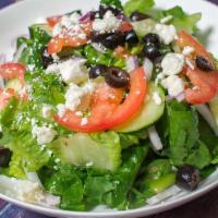 Greek Salad · Fresh organic lettuce, tomatoes, cucumbers, red onion, kalamata olives, feta cheese, and Gre...