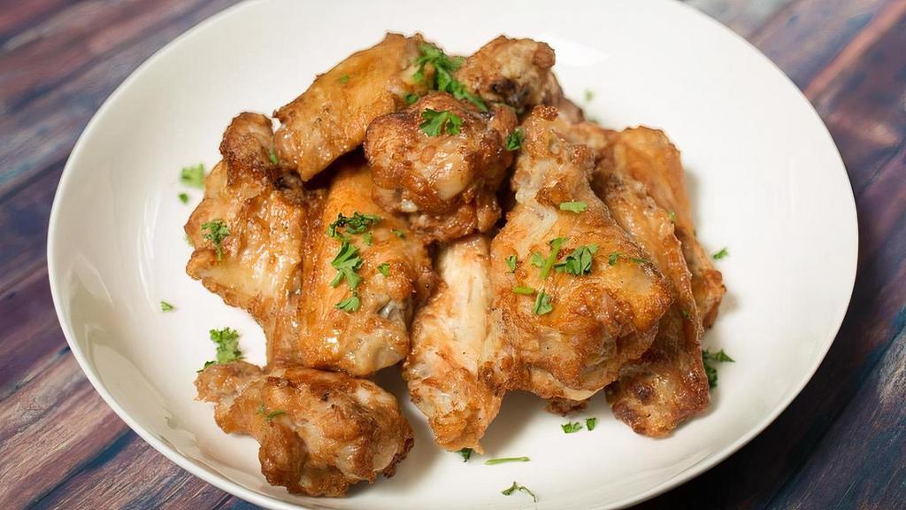Chicken Wings* · Oven Roasted Chicken Wings, seasoned with your choice of dressing.