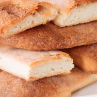 Bread Sticks* · Freshly baked to order bread sticks with a side of tomato sauce.