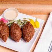 Fried Kibbeh · Extra lean ground beef mixed with cracked wheat, roasted pine nuts, caramelized onion, and f...