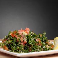 Tabouli · Chopped parsley, tomatoes, onions, lemon juice, cracked wheat, and olive oil.