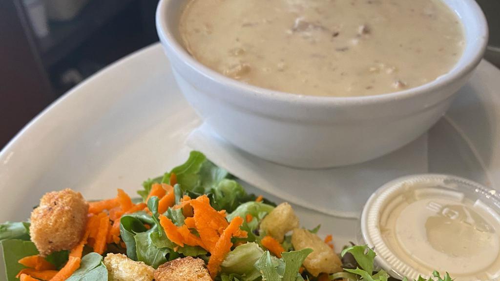 Chowder & Salad · Bowl of Clam Chowder with side garden salad tossed with herb  balsamic vinaigrette and dinner roll