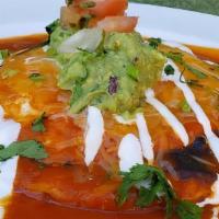 Huevos Rancheros · Corn tortillas, eggs over medium, black beans, jack & cheddar cheese, cilantro, crema, guaca...