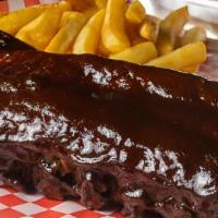 Full Rack Baby Back Ribs · Includes your choice of 6 breadsticks or french fries, 2 sides and 2 a liters soda