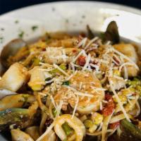 Seafood Linguini · Shrimp, scallops, clams, mussels, calamari, corn, asparagus, onion, tomato and cilantro in a...