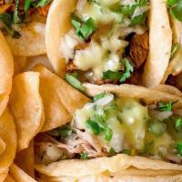 Soft Taco · Your choice of meat, topped with onion, cilantro and creamy guacamole sauce.