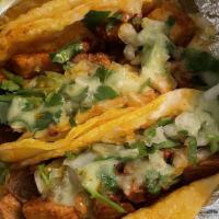 Hard Taco · Your choice of meat, topped with lettuce, creamy guacamole sauce and extra shredded cheddar-...